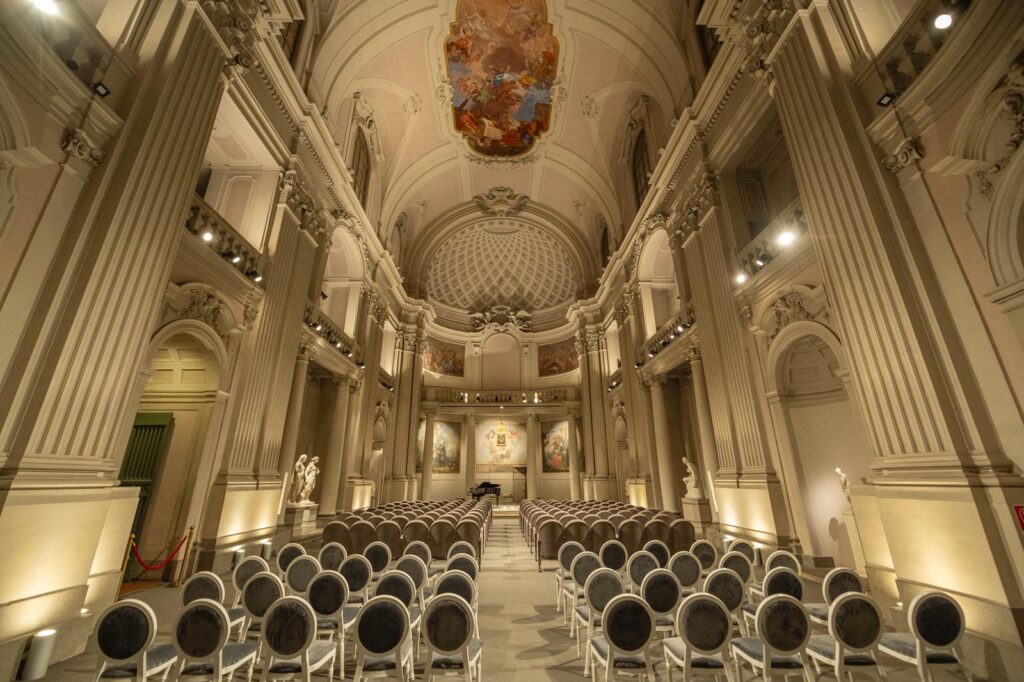 Elegant concert hall with ornate architecture, perfect for chamber music in Florence, Italy.